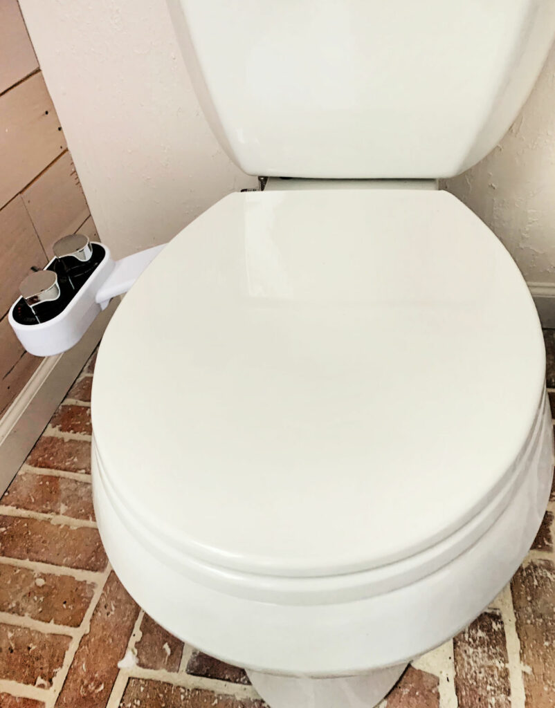 Close up of a toilet with a bidet. 