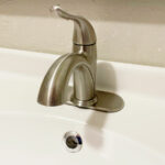 Brushed nickel bathroom sink faucet.