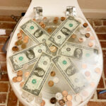 Epoxy toilet seat with money in the resin.